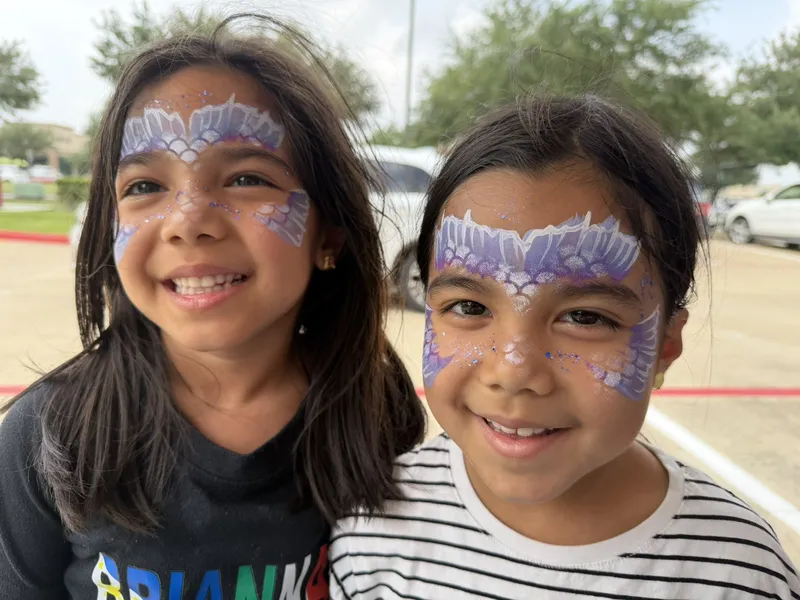 Waterproof face painting at a summer outdoor event